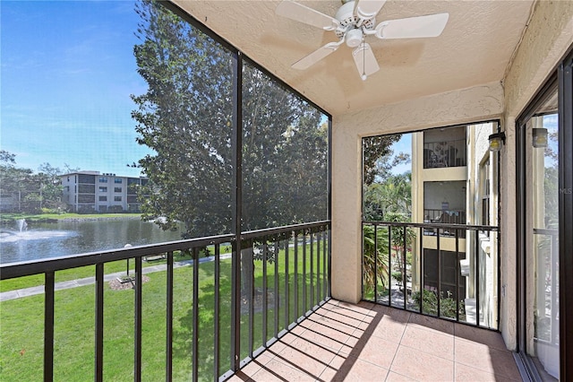 unfurnished sunroom featuring a water view