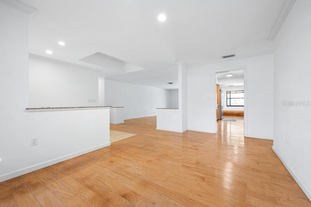 spare room featuring visible vents, recessed lighting, baseboards, and light wood-style floors