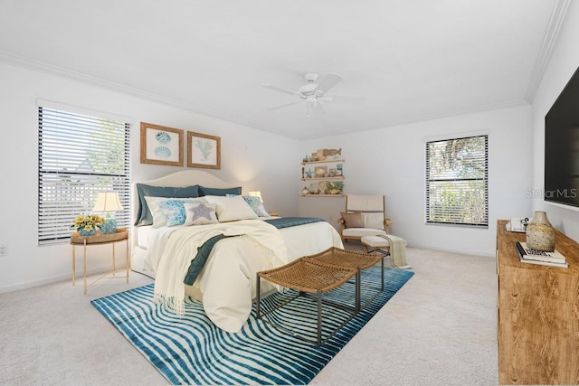 bedroom with ceiling fan, multiple windows, carpet floors, and ornamental molding