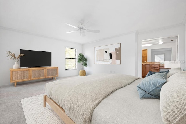 carpeted bedroom featuring crown molding and a ceiling fan