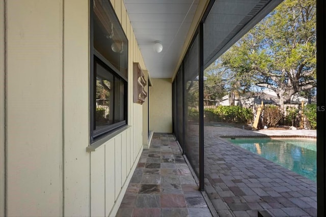 exterior space featuring a fenced in pool and a patio