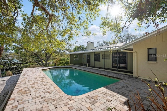 outdoor pool featuring a patio area