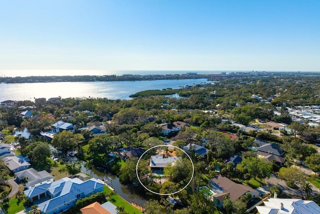 bird's eye view featuring a water view and a residential view