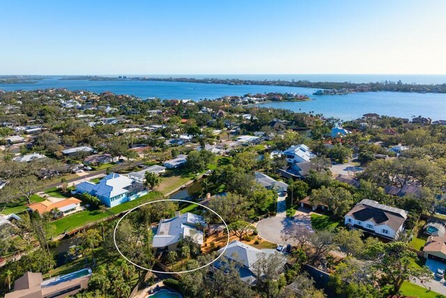 birds eye view of property featuring a residential view and a water view