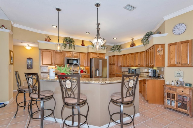 kitchen featuring visible vents, ornamental molding, backsplash, stainless steel appliances, and light tile patterned flooring