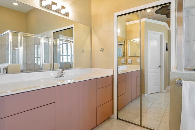 bathroom with recessed lighting, a stall shower, vanity, and tile patterned flooring