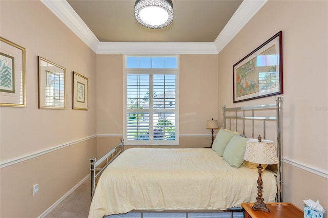 bedroom with baseboards and crown molding