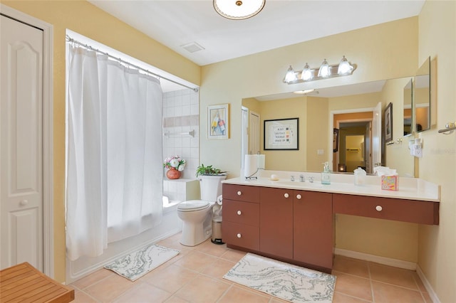 full bath with tile patterned floors, toilet, shower / tub combo, baseboards, and vanity