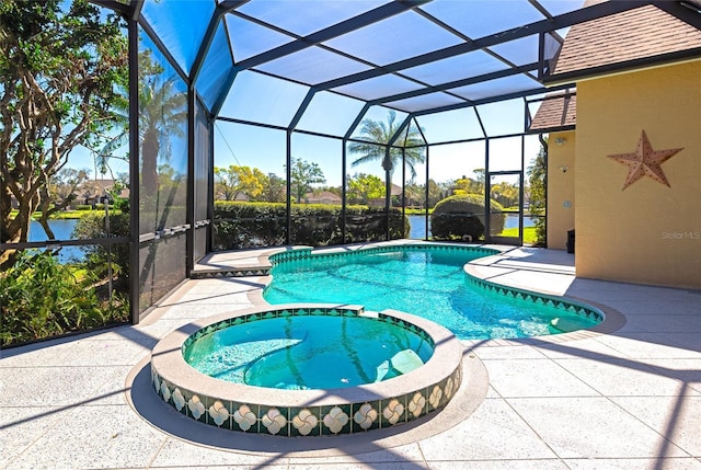 view of swimming pool with a pool with connected hot tub, a lanai, and a patio area