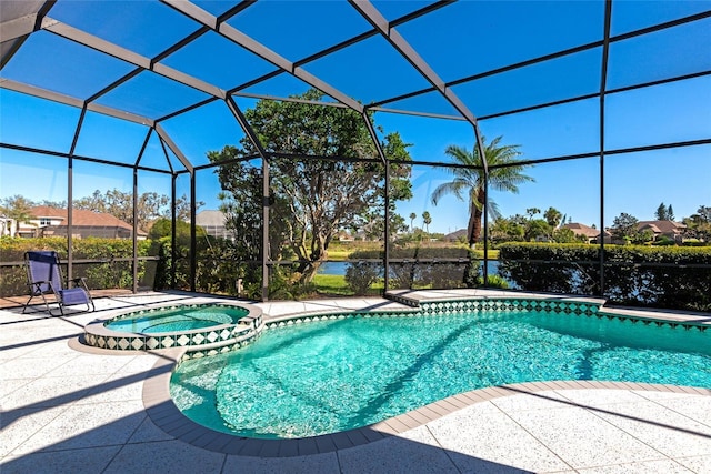 view of swimming pool with a patio area, a lanai, a pool with connected hot tub, and a water view