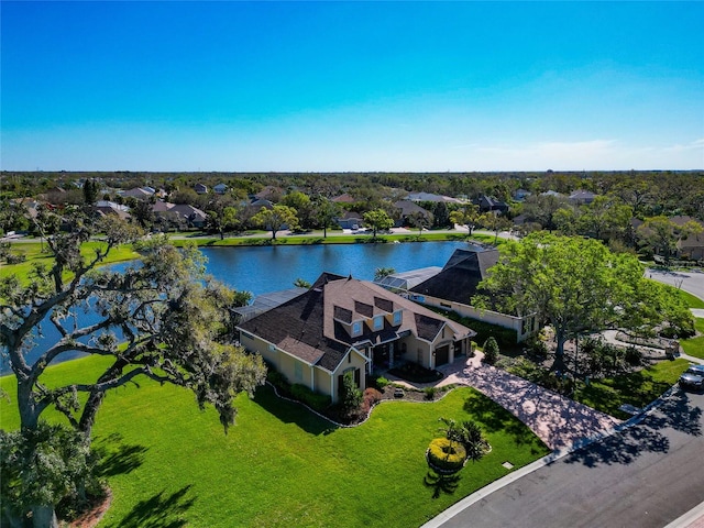 bird's eye view featuring a residential view and a water view