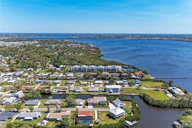 drone / aerial view with a residential view and a water view