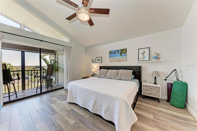 bedroom with access to exterior, wood finished floors, baseboards, ceiling fan, and vaulted ceiling