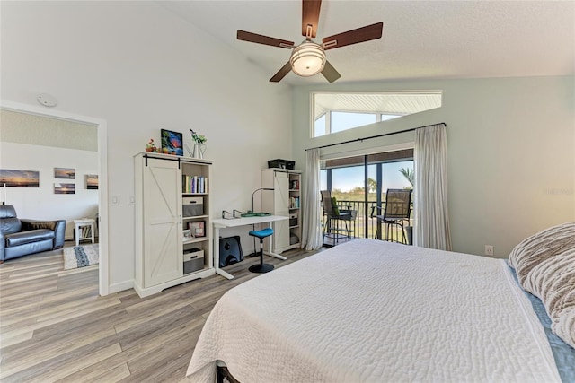 bedroom featuring wood finished floors, baseboards, high vaulted ceiling, ceiling fan, and access to outside