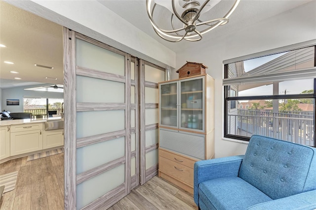 living area featuring recessed lighting, a healthy amount of sunlight, and light wood finished floors