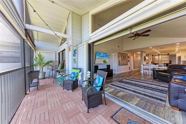 exterior space with ceiling fan and lofted ceiling