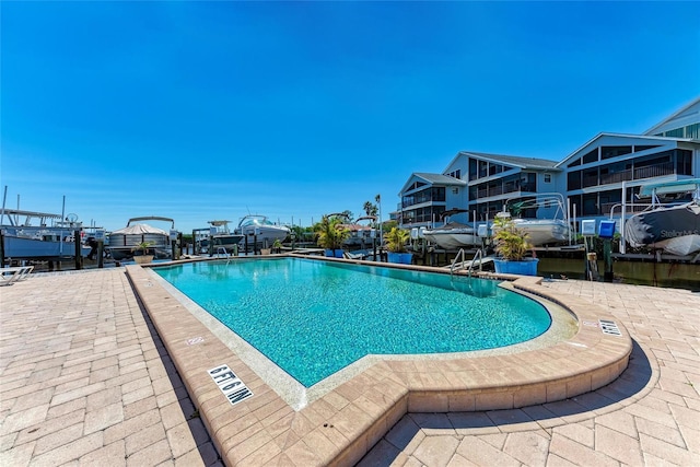 community pool featuring a patio area