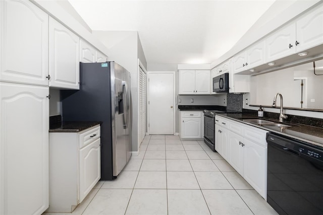 kitchen with light tile patterned floors, white cabinets, black appliances, and a sink