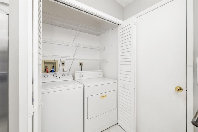 laundry area with laundry area and separate washer and dryer