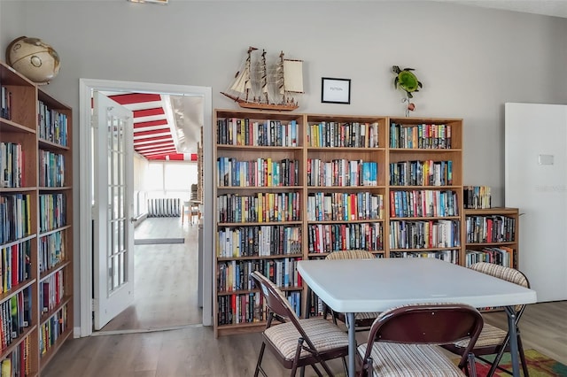 interior space featuring wood finished floors and bookshelves