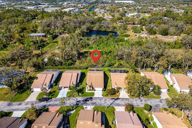 drone / aerial view with a residential view and a water view