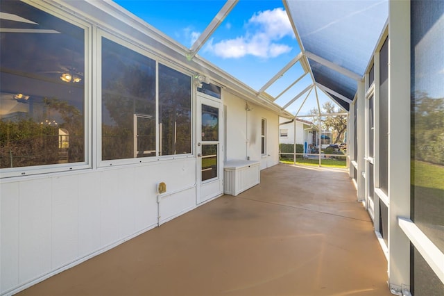 unfurnished sunroom with vaulted ceiling