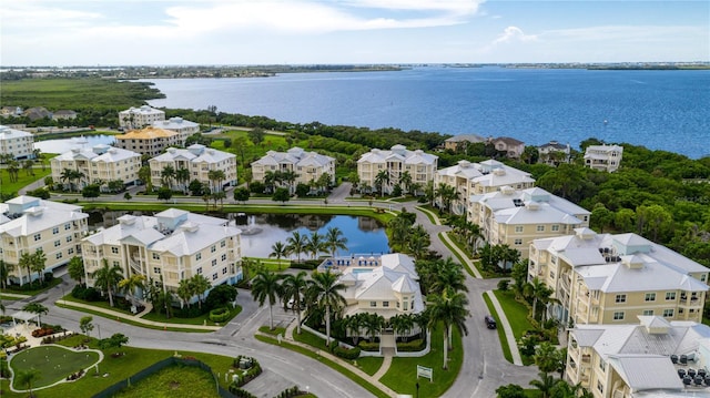 drone / aerial view with a residential view and a water view