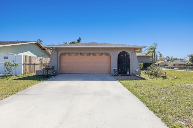 ranch-style home with fence, driveway, stucco siding, a front lawn, and a garage