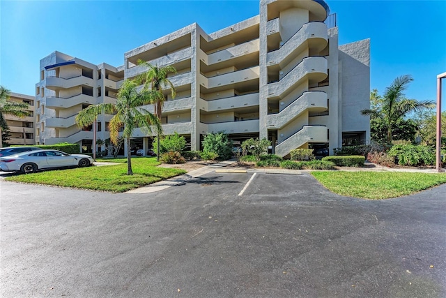 view of property with uncovered parking