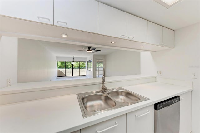 kitchen with ceiling fan, a sink, light countertops, white cabinets, and stainless steel dishwasher