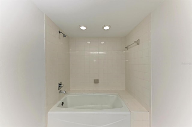 bathroom featuring recessed lighting and shower / bathtub combination