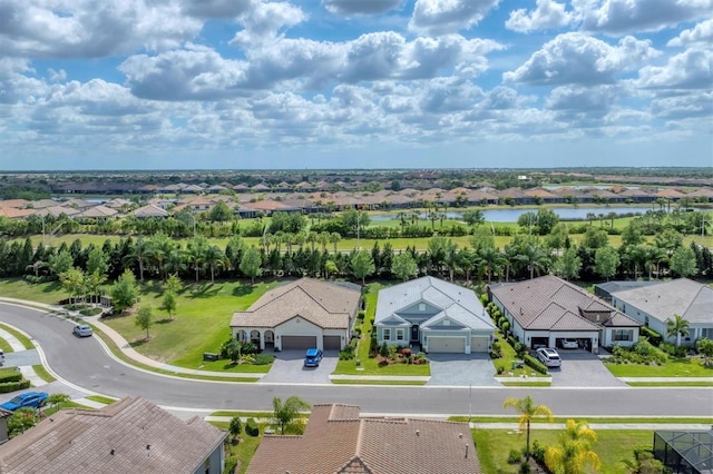 bird's eye view featuring a residential view and a water view