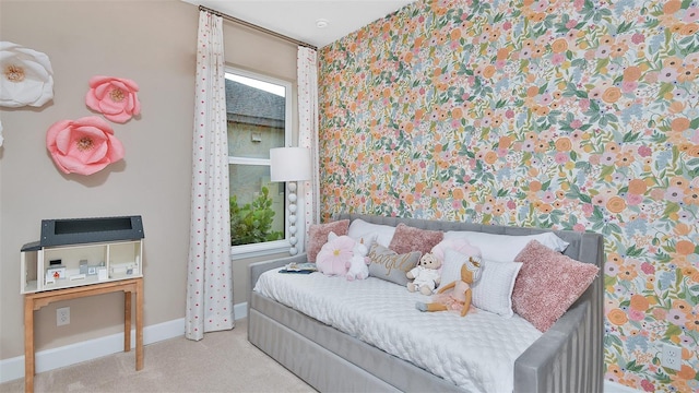 carpeted bedroom featuring baseboards