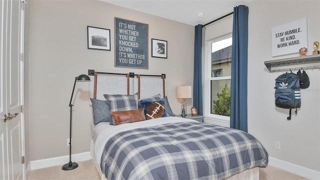 carpeted bedroom with baseboards