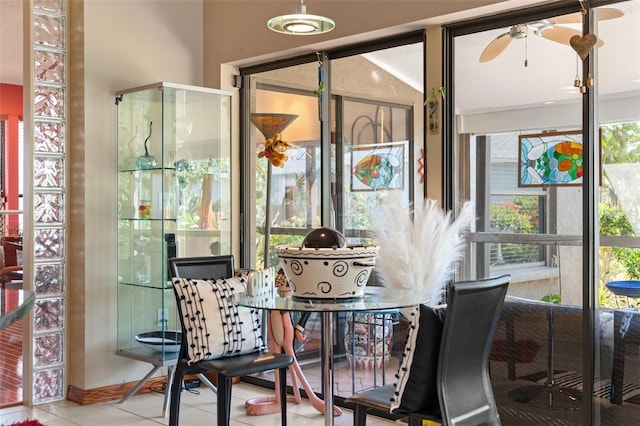 sunroom with a ceiling fan