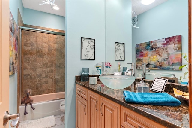 bathroom with vanity, toilet, tile patterned flooring, and shower / bath combination