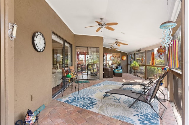 sunroom / solarium featuring lofted ceiling