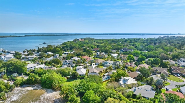 drone / aerial view featuring a residential view and a water view