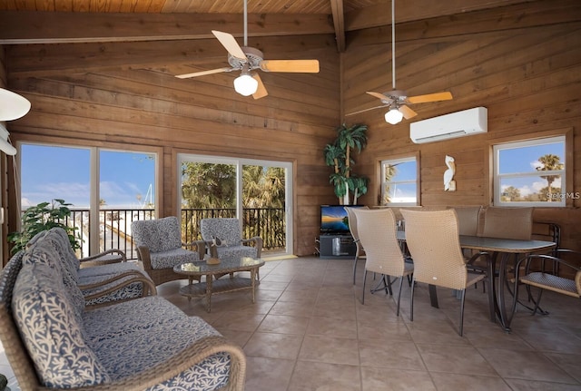 dining area featuring a wall unit AC, wood walls, tile patterned flooring, wood ceiling, and ceiling fan