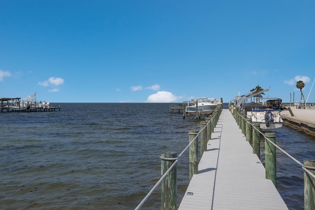 view of dock featuring a water view and boat lift