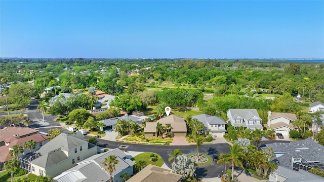 birds eye view of property with a residential view and a view of trees