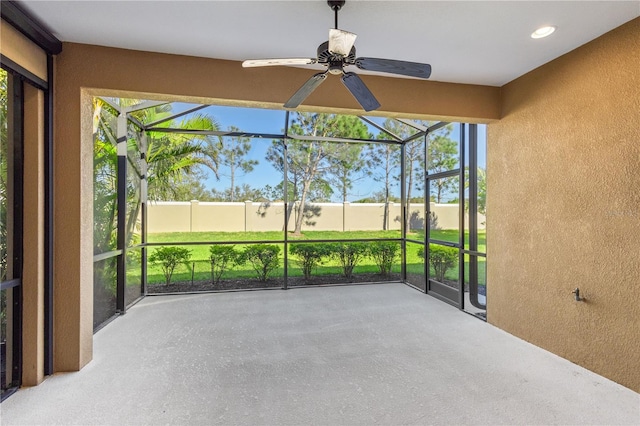 sunroom with a ceiling fan