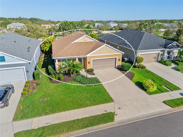 ranch-style home featuring driveway, roof with shingles, a front lawn, a garage, and a residential view