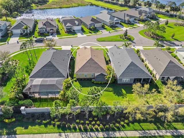 aerial view with a residential view and a water view