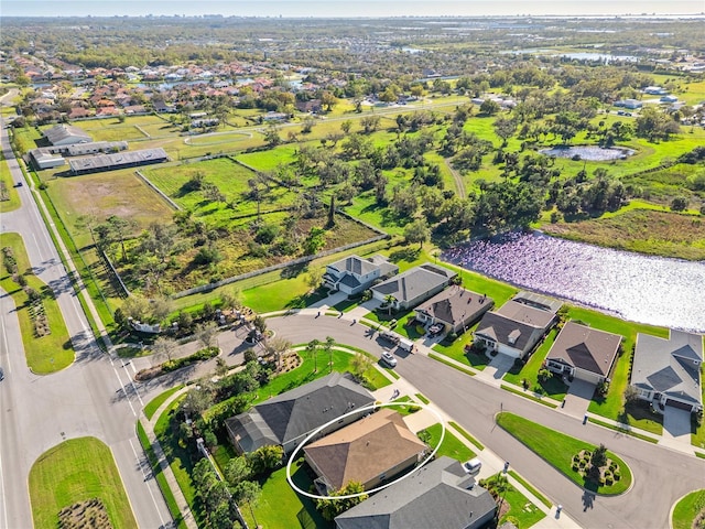 birds eye view of property with a residential view