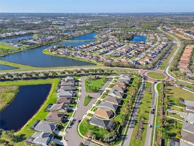 bird's eye view with a residential view and a water view
