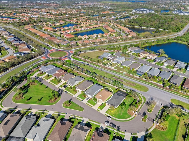 birds eye view of property featuring a residential view and a water view