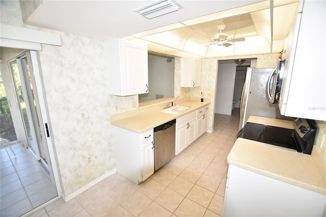 kitchen with visible vents, a sink, light countertops, white cabinets, and appliances with stainless steel finishes