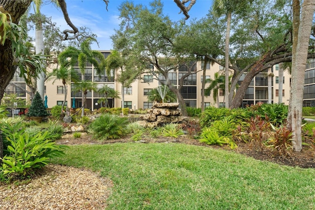 515 30th Ave W Unit H410, Bradenton, FL 34205 - view of community featuring a lawn