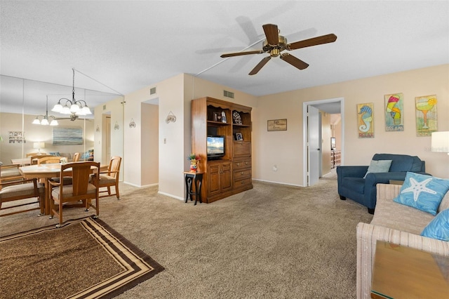 carpeted living room featuring visible vents, ceiling fan with notable chandelier, a textured ceiling, and baseboards